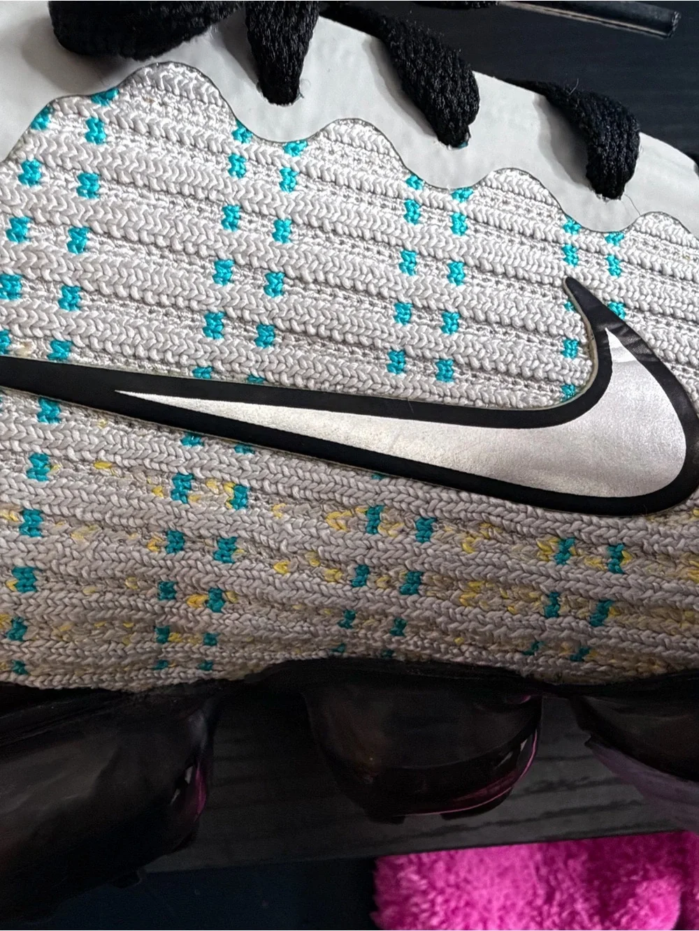 Nike Men’s White Knit Sneakers with Black Accents and Teal Dots